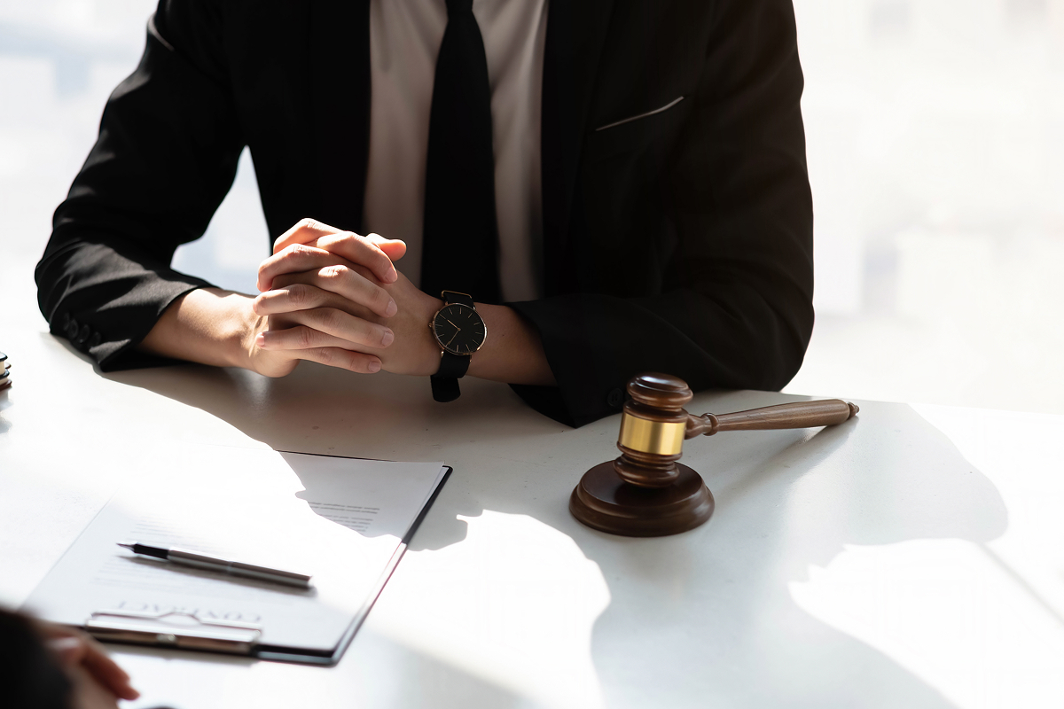 A lawyer consulting with their client in an office