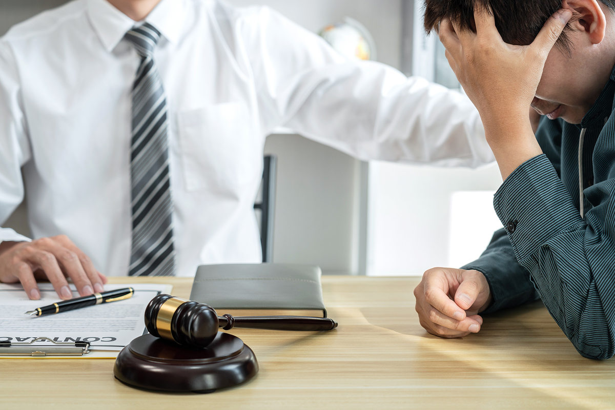 A lawyer having a consultation with a distressed client