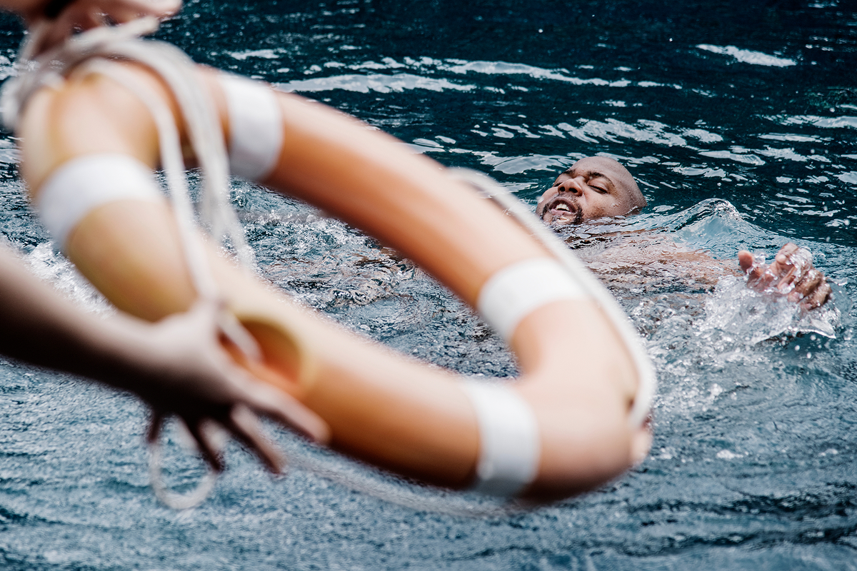 A man being rescued at sea